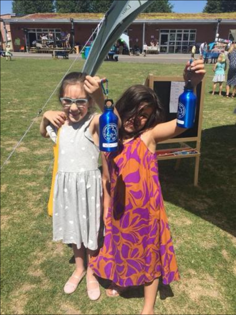 Fielding Primary Summer Fair going green - showing off refillable water bottles